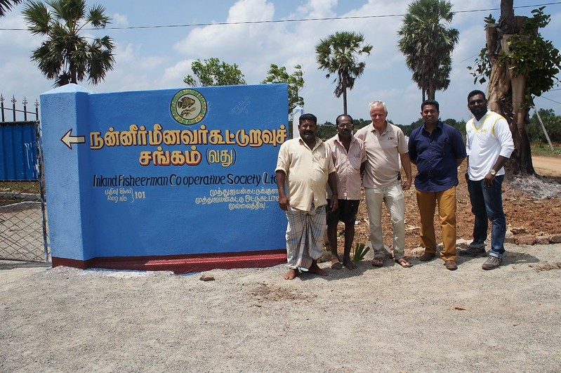 Divron staff outside an Inland Fishermen Co-operative Society building